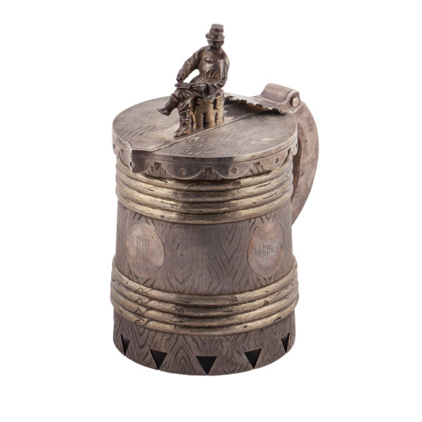 Lot 0076 <br/>A massive Russian trompe l'oeil silver-gilt mug with cast and chased peasant blacksmith on the top <br/>Estimate: 15000-20000€