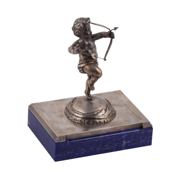 Lot 0152 <br/>A Faberge cast silver and lapis lazuli stone paperweight "Cupid" <br/>Estimate: 4000-6000€