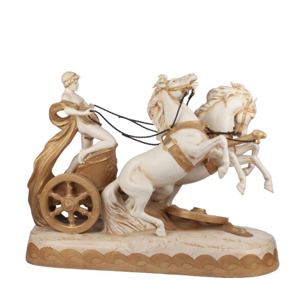 Lot 0094 <br/>A Royal Dux Bohemia porcelain figure group of a youth riding a chariot <br/>Estimate: 600-700€