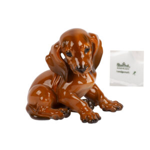 Lot 0139 <br/>Rosenthal Porcelain Figure of a Seated Dachshund, Germany, Hand-Painted <br/>Estimate: 150-200€
