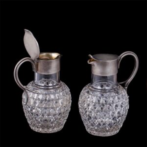 A pair of Faberge silver and cut-glass carafes — image 1