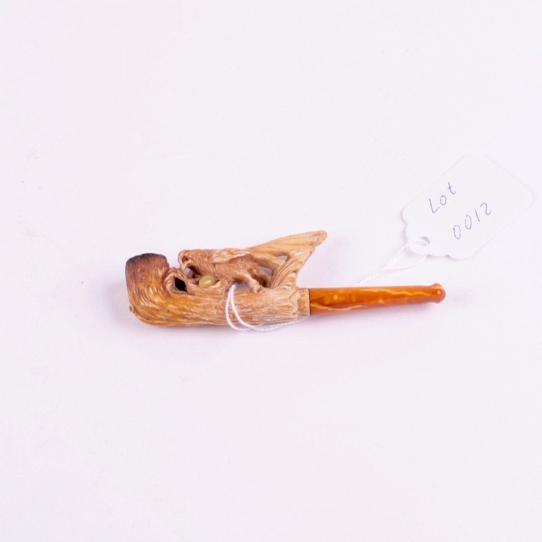 Antique smoking pipe with amber in case. — image 1