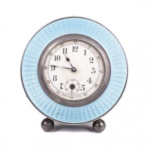 Desk clock with silver on legs — image 1