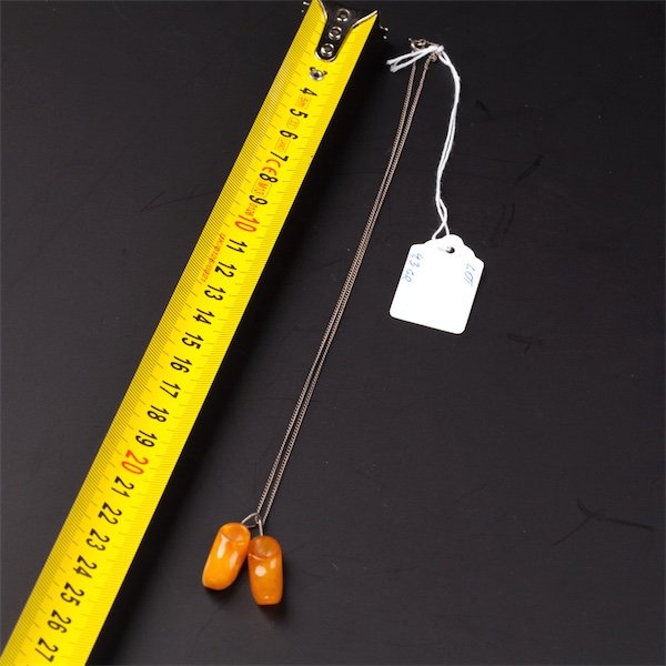 Amber "shoes" pendant with silver chain. — image 2