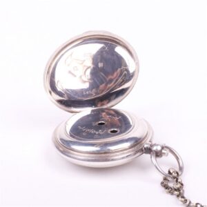 Silver pocket watch with the key — image 3