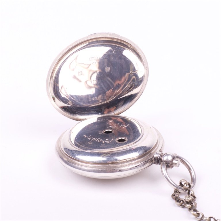 Silver pocket watch with the key — image 3
