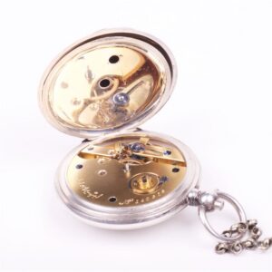 Silver pocket watch with the key — image 6