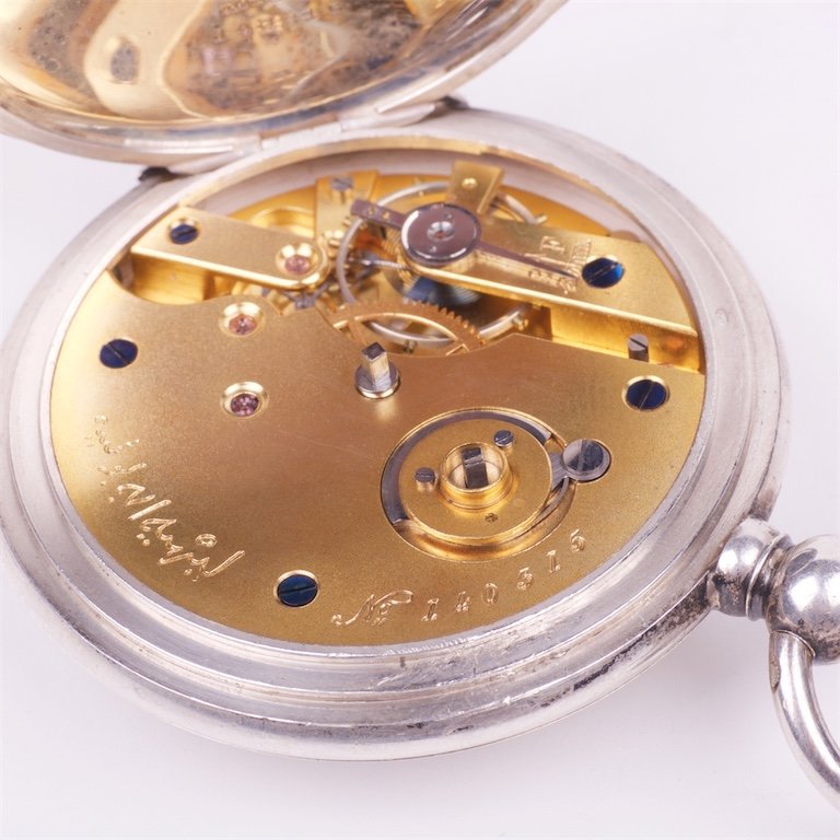 Silver pocket watch with the key — image 7