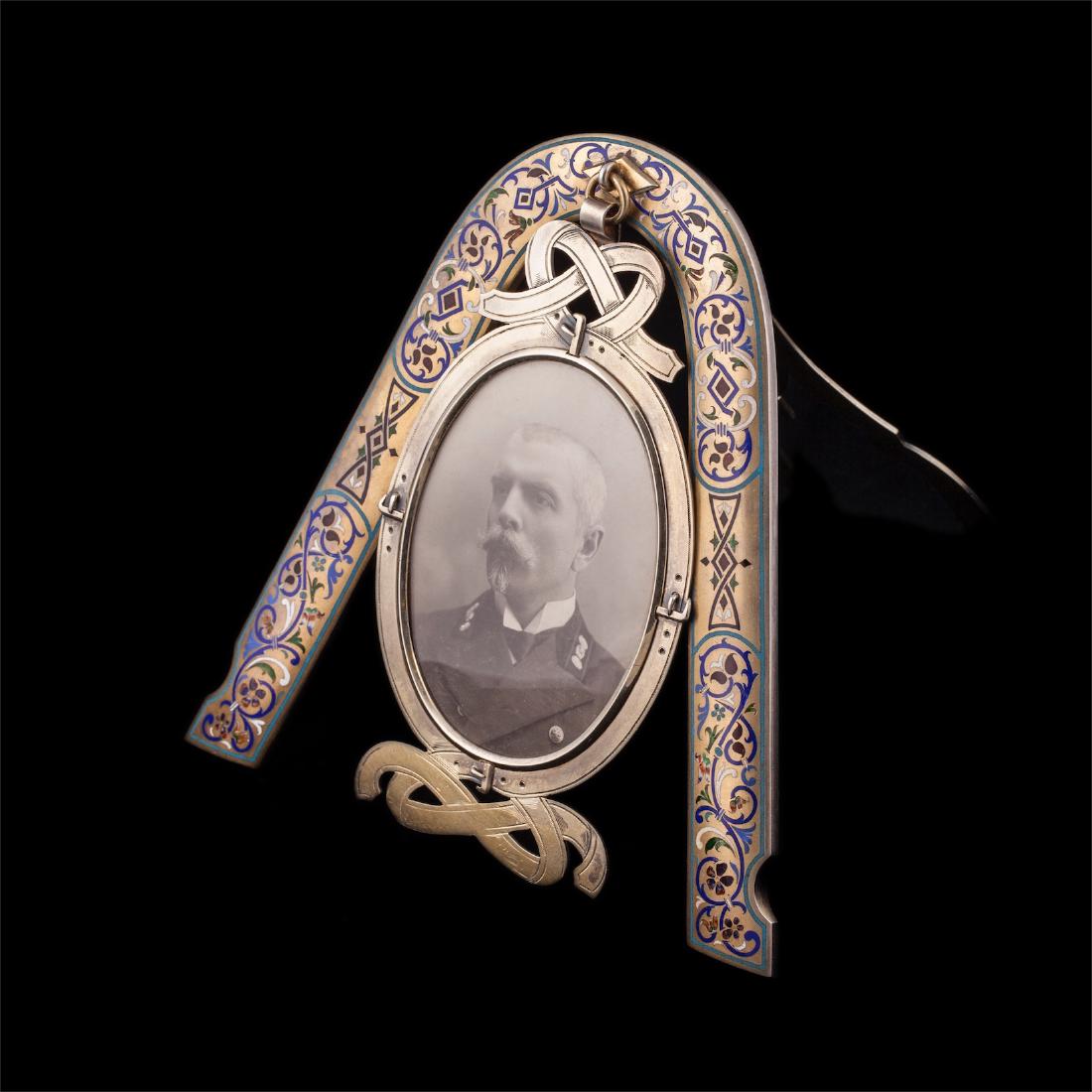 Silver-gilt and enamel photo frame in the shape of — image 1