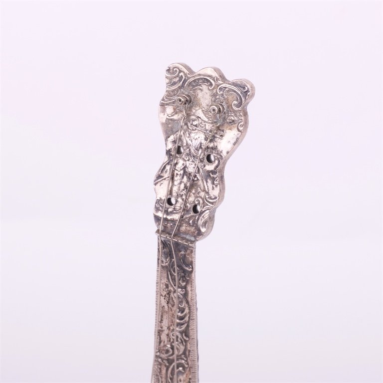 Silver musical instrument. — image 2