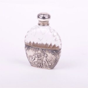 Glass bottle with silver inserts. — image 1