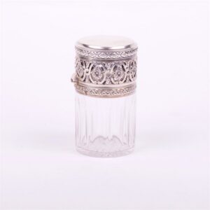 Glass bottle with silver cover. — image 1