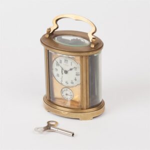 Oval shape carriage alarm clock "E. Fachat". — image 1