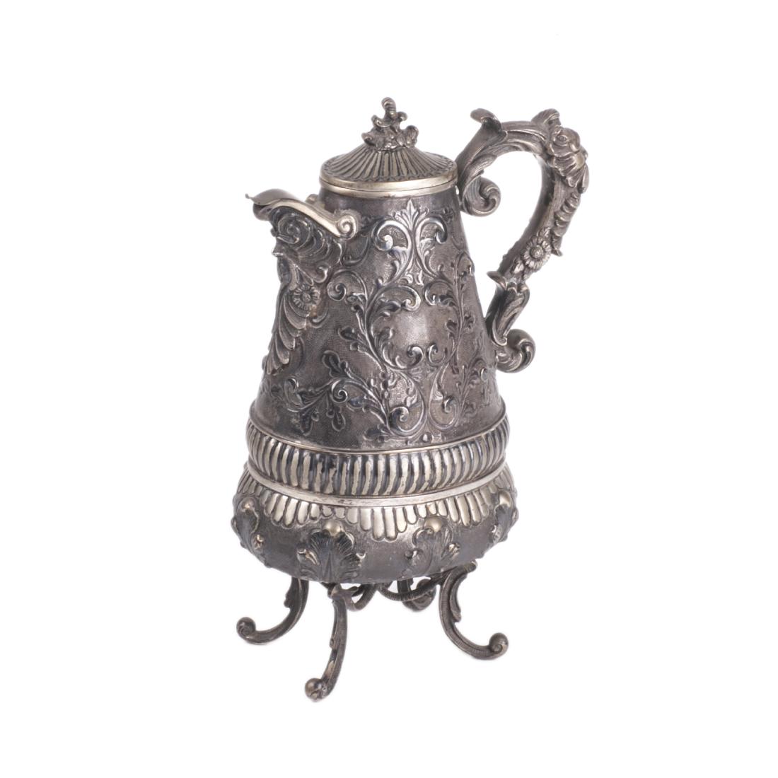 Antique silver water jug on legs — image 1