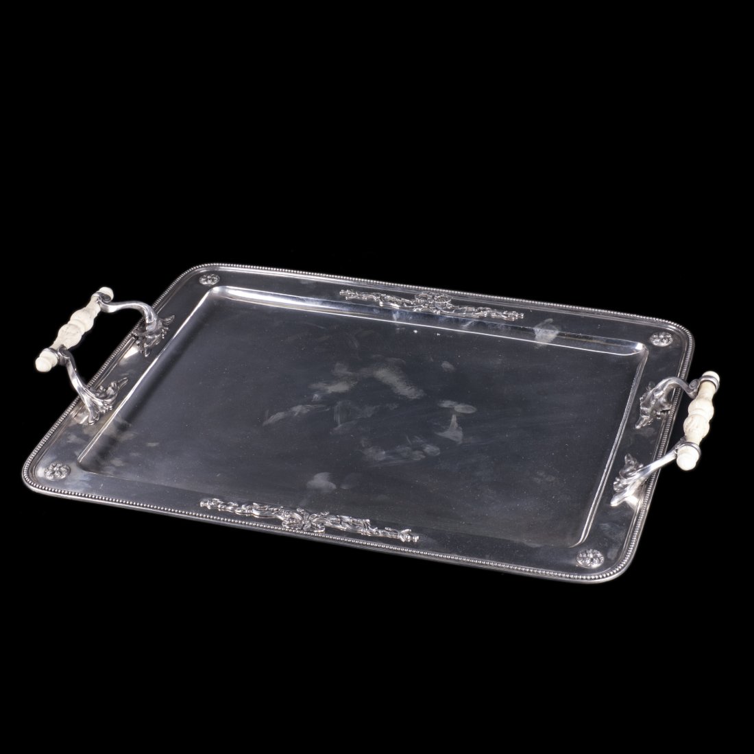 Antique silver tray with white material handles — image 1