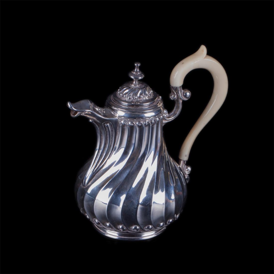 Antique French silver creamer with white material — image 1