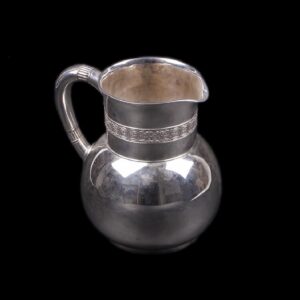 A Tiffany & Co silver water pitcher with wave motif — image 1