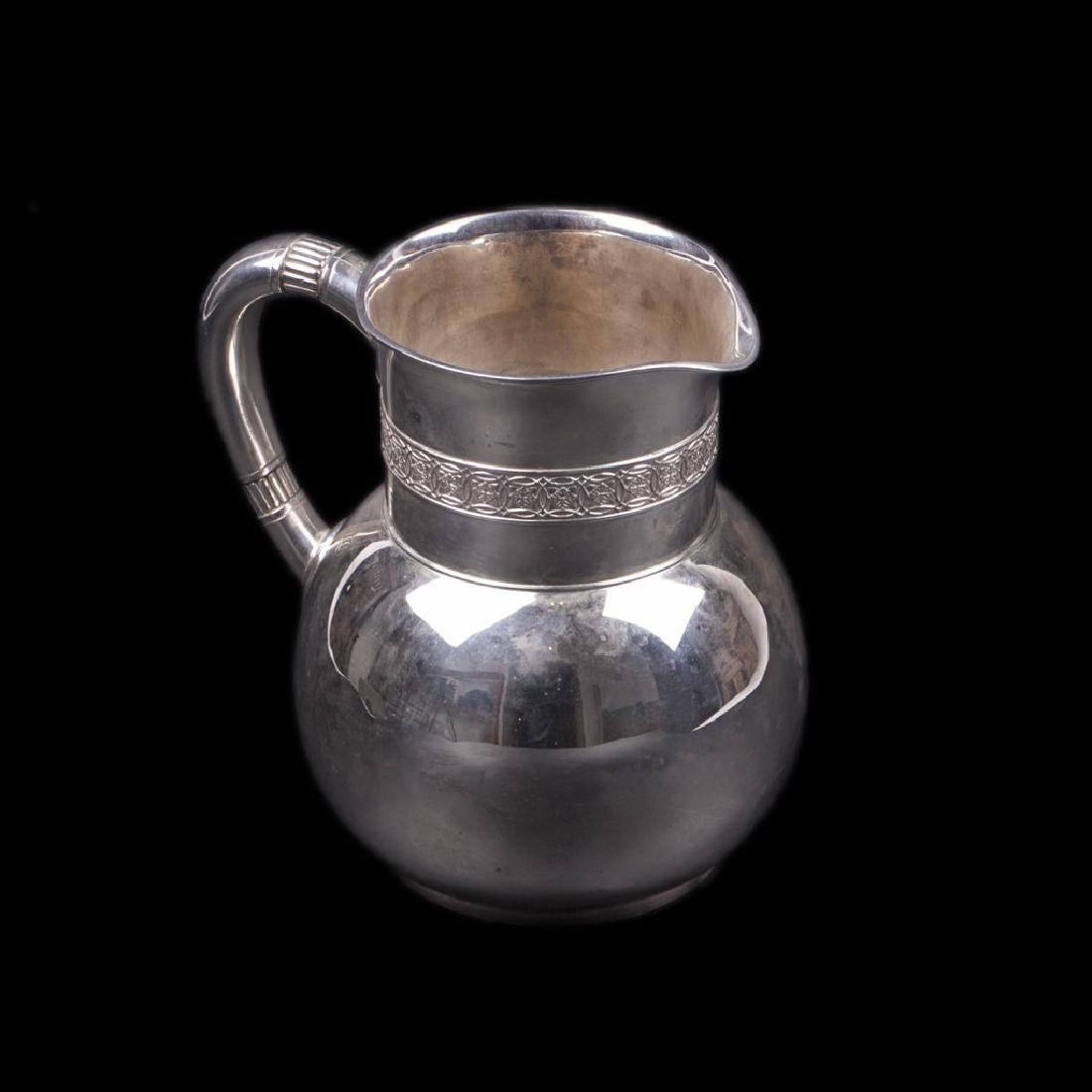 A Tiffany & Co silver water pitcher with wave motif — image 1