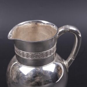 A Tiffany & Co silver water pitcher with wave motif — image 3
