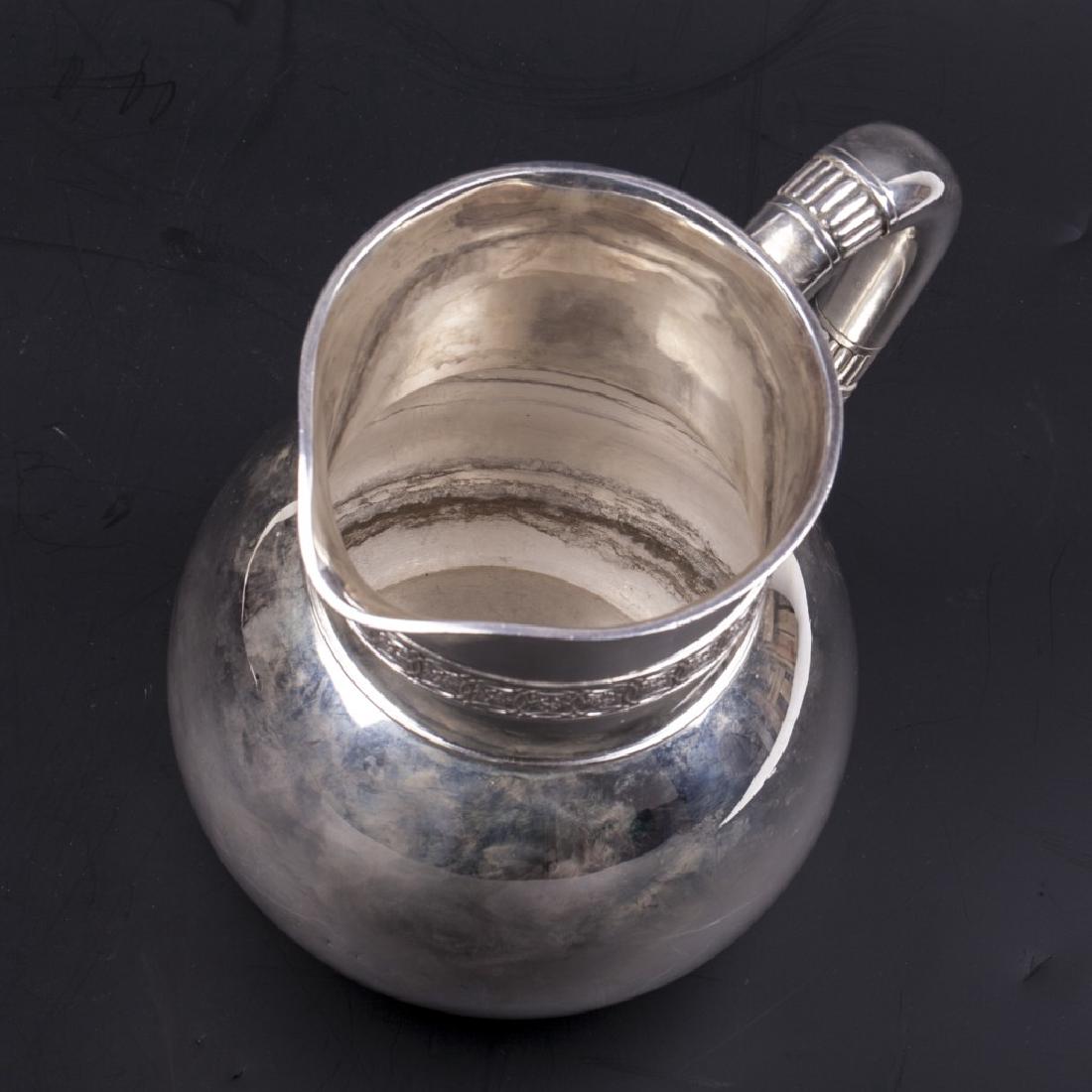 A Tiffany & Co silver water pitcher with wave motif — image 4