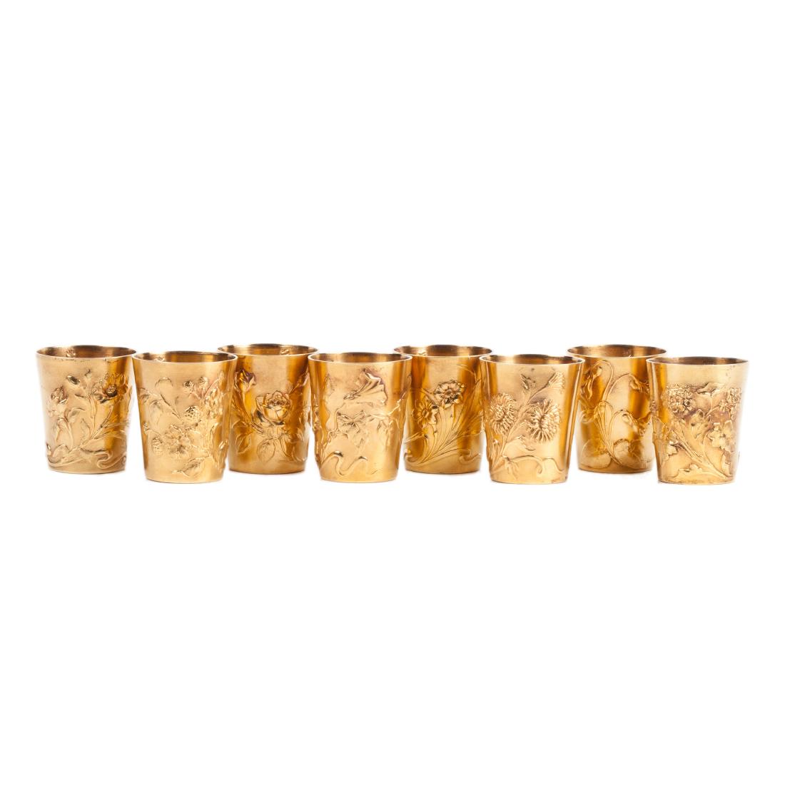Antique set of 8 Art Nouveau silver gilt beakers — image 1