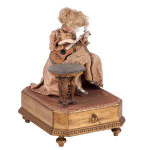 Antique music doll playing on Guitar on stand — image 1