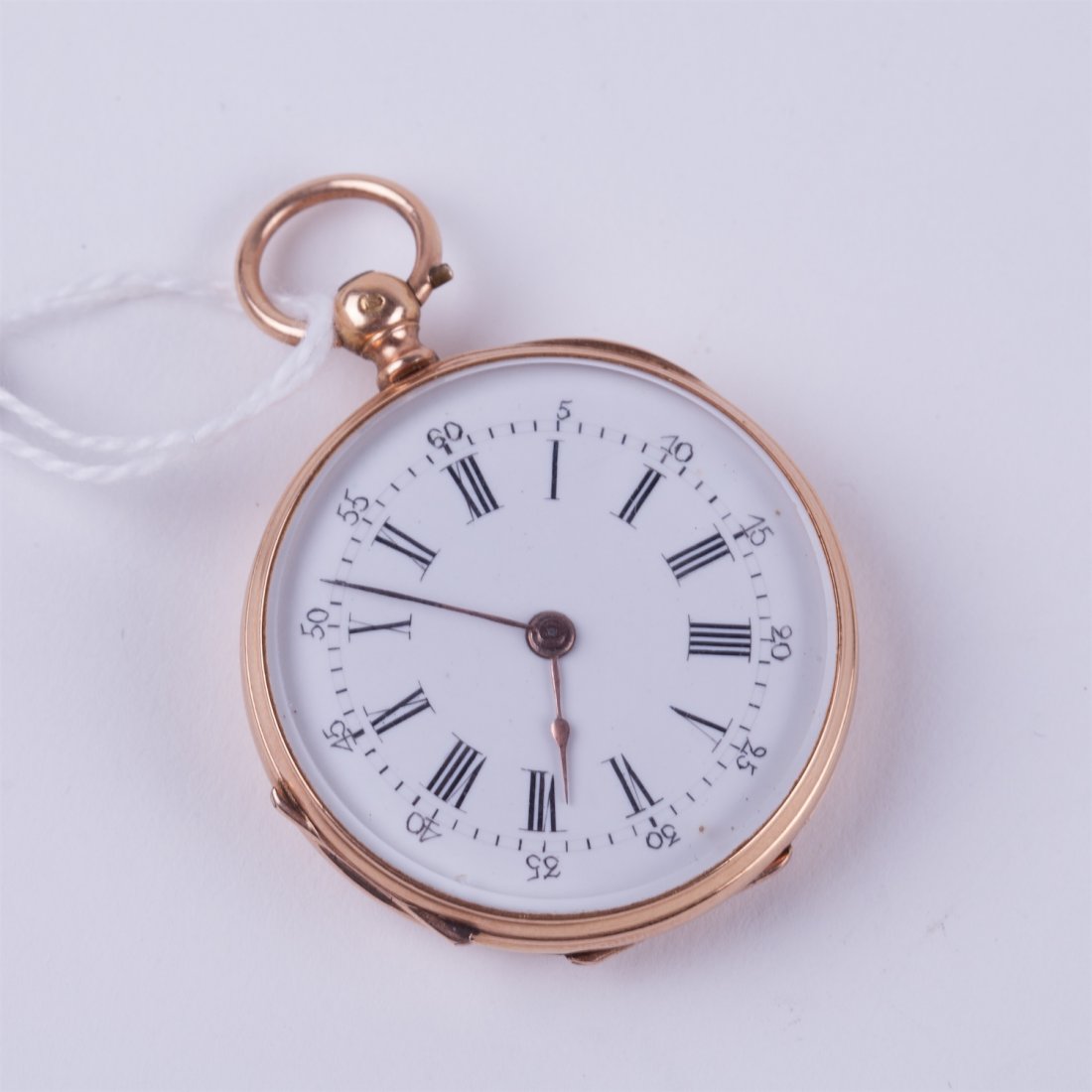 Open face gold pocket watch witch key. — image 1