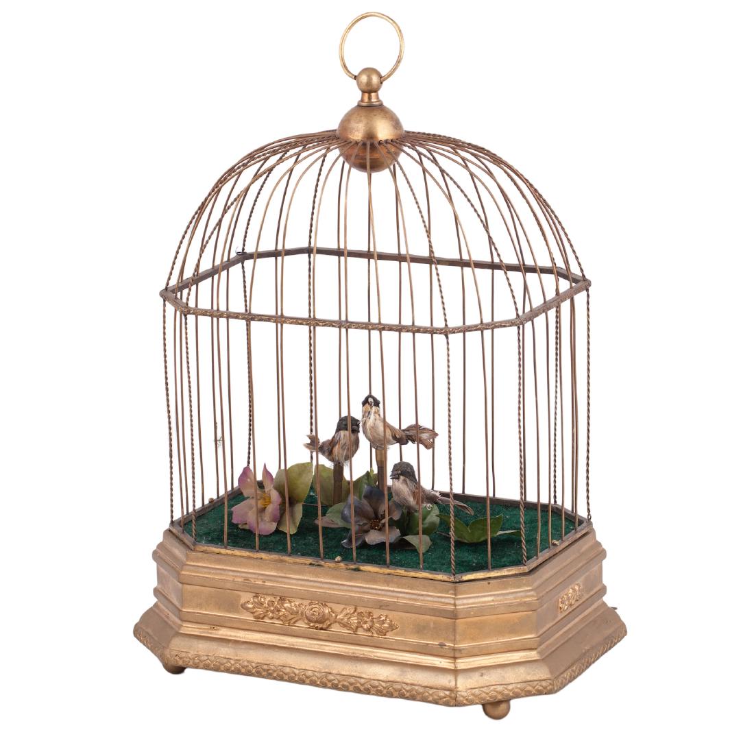 Musical antique cage with three birds in it — image 1