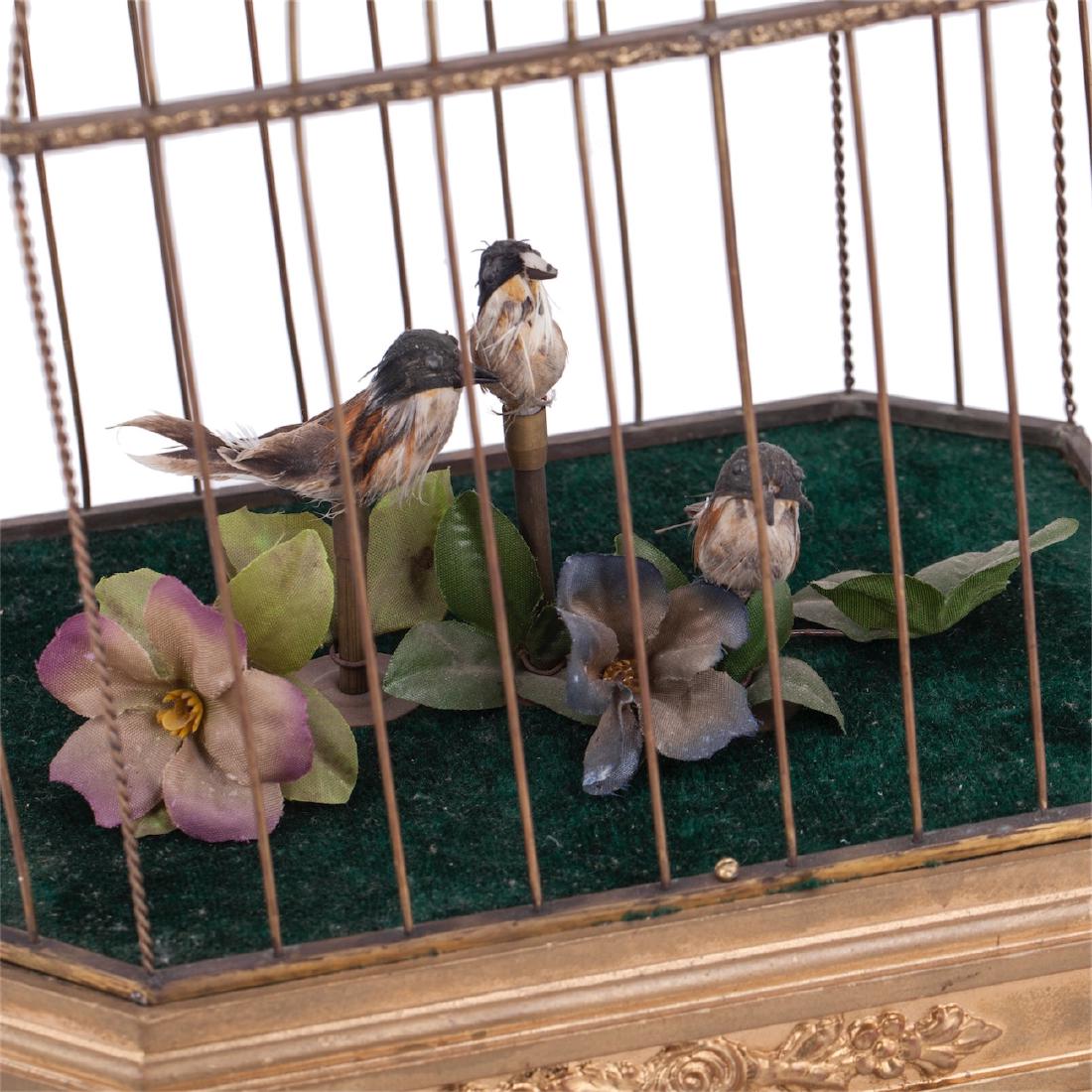 Musical antique cage with three birds in it — image 2