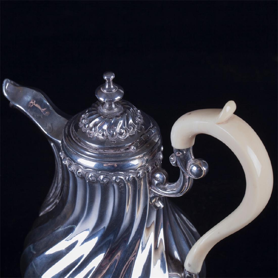 Antique French silver creamer with white material — image 3