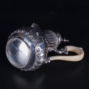 Antique French silver creamer with white material — image 4