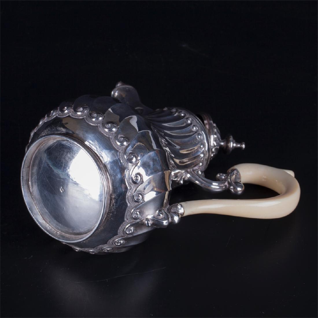 Antique French silver creamer with white material — image 4