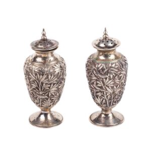 A pair of antique silver salt cellars with floral — image 1