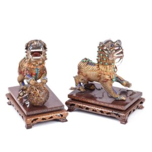Chinese figures of Imperial guardian lions on wooden — image 1