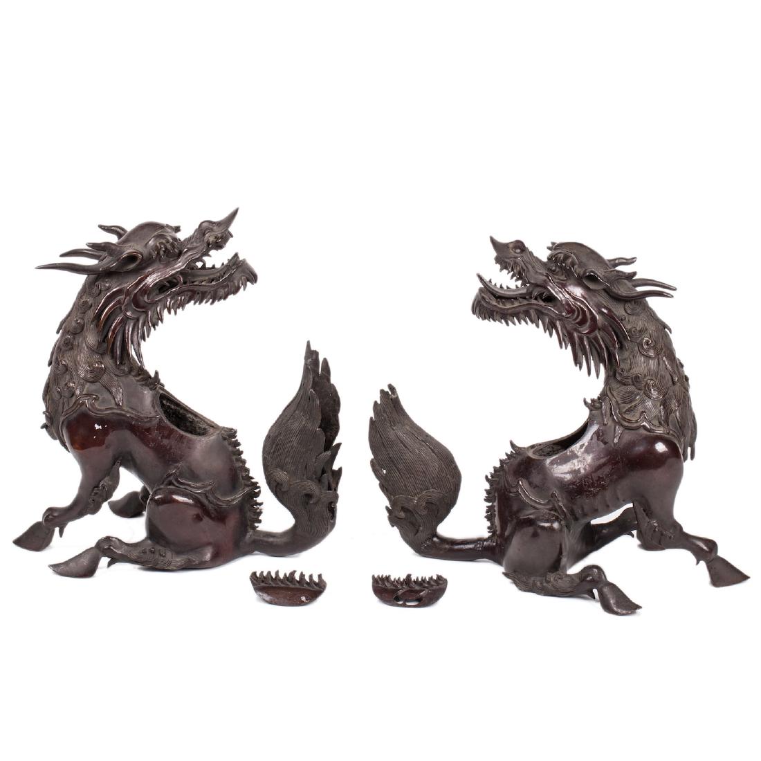 A pair of Chinese bronze dragon sculptures — image 1