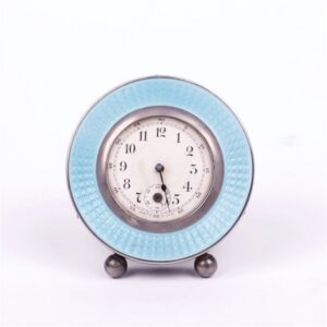 Desc clock with silver on legs. — image 1