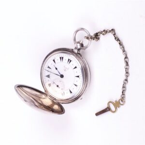 Silver pocket watch with the key. — image 1