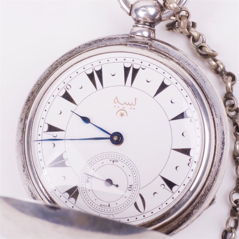 Silver pocket watch with the key. — image 2